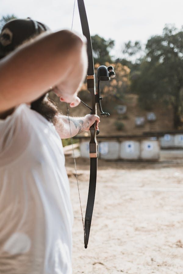 A trident is setting a target for shooting an arrow